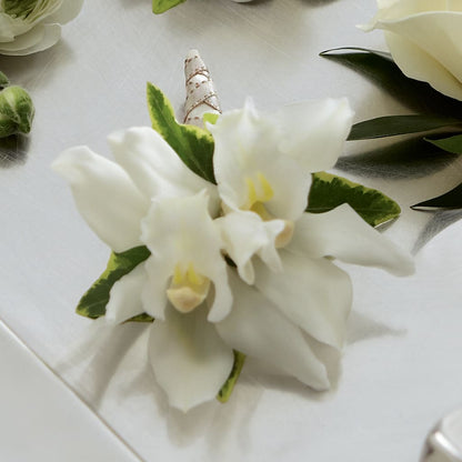 White Mini Cymbidium Boutonniere –  Greater Oklahoma City Flower Shop, Oklahoma City OK